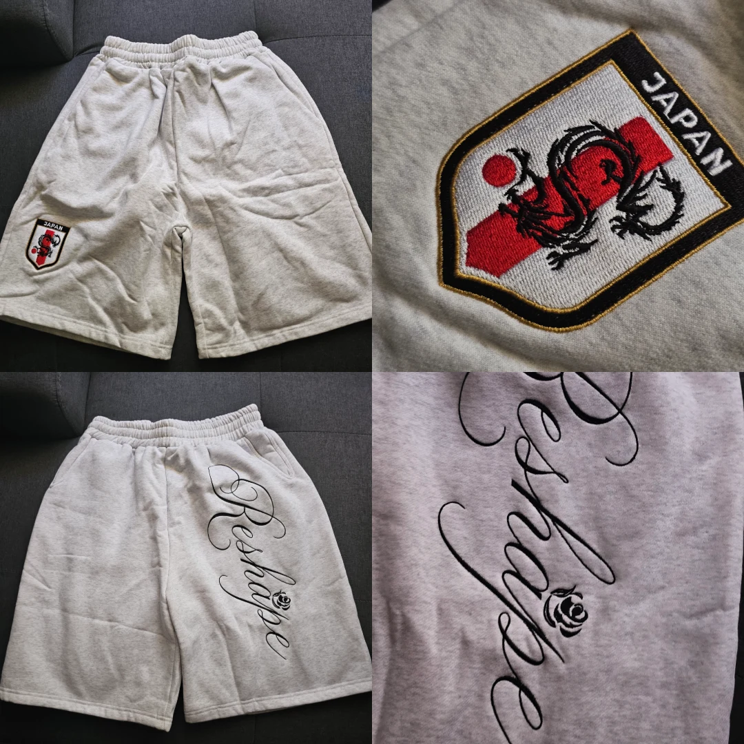 Short gris avec emblème du Japon et détails de broderie
